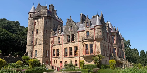 Belfast Castle Scottish Baronial sandstone building against Cave Hill backdrop