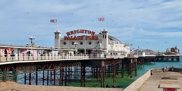 Brighton Palace Pier Victorian seaside amusement park panorama with ferris wheel