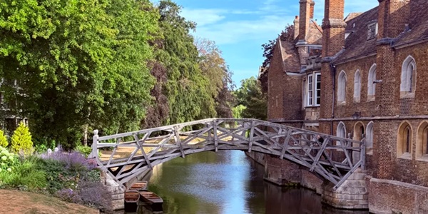 Mathematical Bridge tangent and radial truss wooden structure reflected in the River Cam