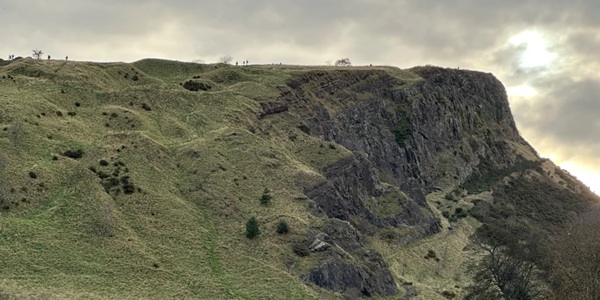Arthur's Seat volcano peak panorama with Edinburgh city skyline