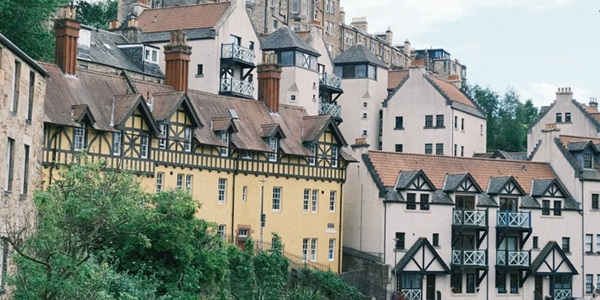 Dean Village red sandstone buildings and Water of Leith valley panorama