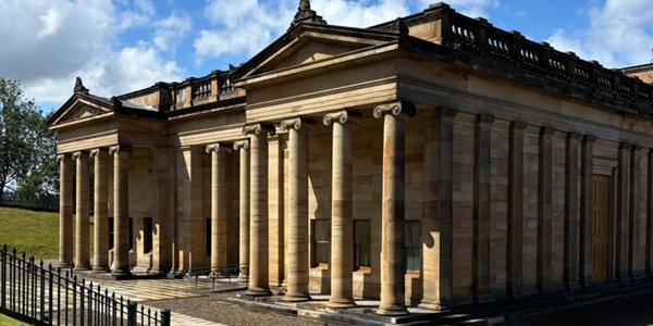Scottish National Gallery neoclassical building and panoramic view of Princes Street Gardens