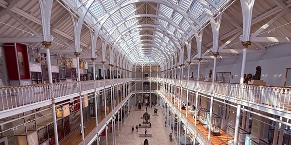 Panoramic view of the National Museum of Scotland Grand Gallery glass dome and cast-iron colonnades