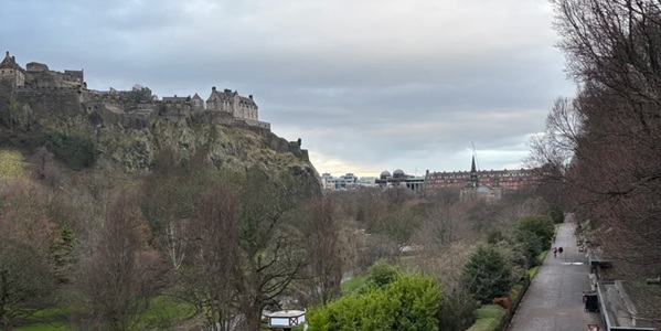 Panoramic view of Princes Street Gardens Ross Fountain with Edinburgh Castle