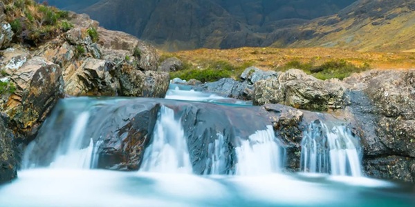 Fairy Pools crystal blue pools and Black Cuillin mountains