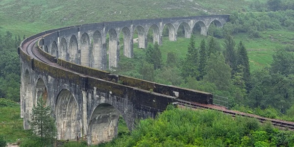 Glenfinnan Viaduct steam train crossing the arched bridge