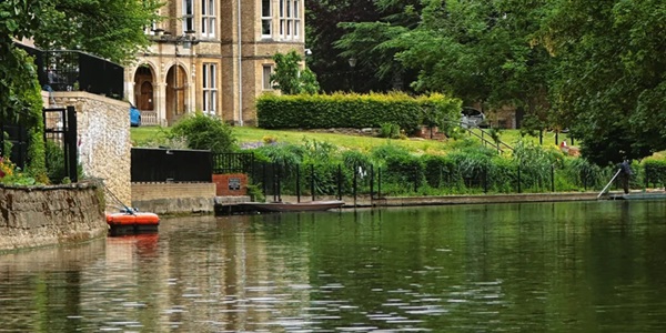 Punting on the River Cherwell with Magdalen College Tower reflected in the water