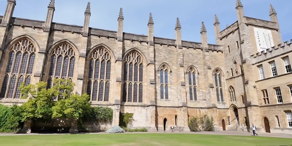 New College medieval cloisters with chapel and city wall panorama