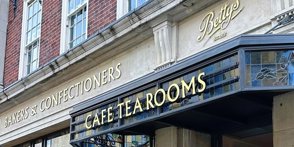 Betty's Tea Room three-tier silver afternoon tea stand with classic English scones